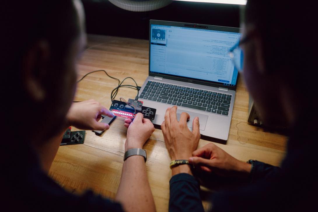 student and professor working in the design circuit lab